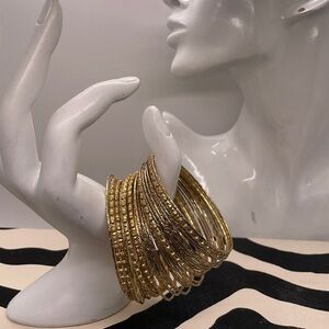 30 Beautiful Gold Tone Bangles.